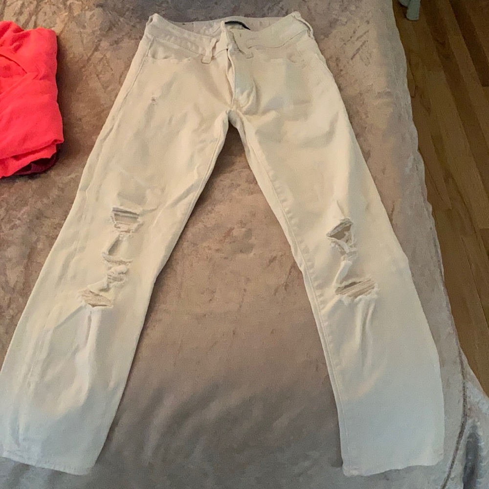 Super super stretch white ripped skinny jeans